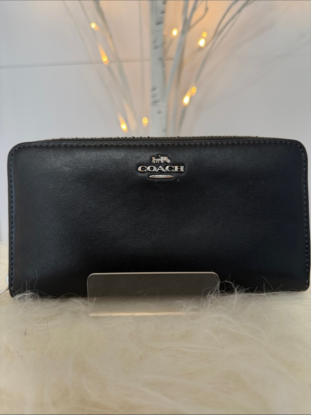 Coach NWOT black leather full zip around wallet W/16 card slots . Lightweight.